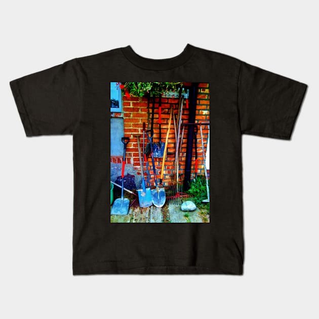 Rakes & Shovels Leaning on a Brick Wall in the Garden Kids T-Shirt by 1Redbublppasswo